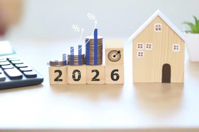 Défiscalisation immobilière en 2026 avec maison, calculatrice et graphique fiscal